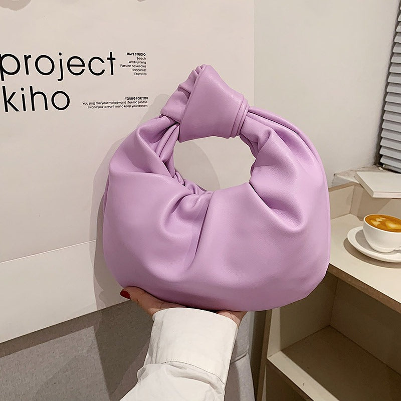 Simple handbag. High-end niche cloud bag.