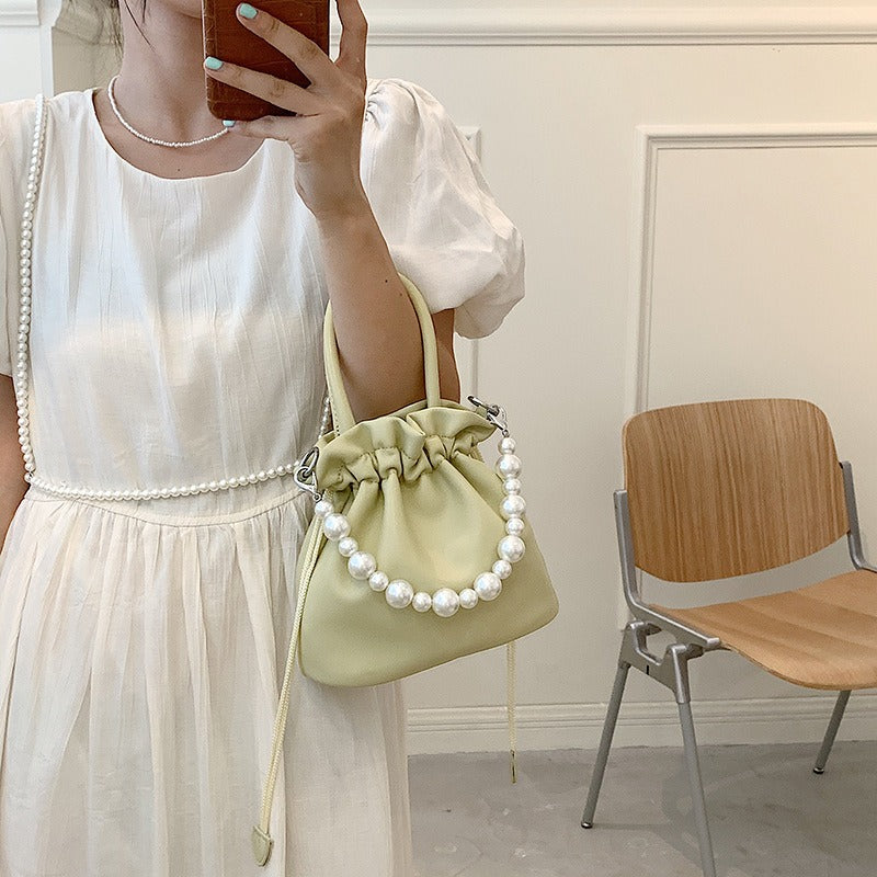 Pearl chain pleated shoulder bag women new solid color soft surface ins beam mouth portable Messenger bag